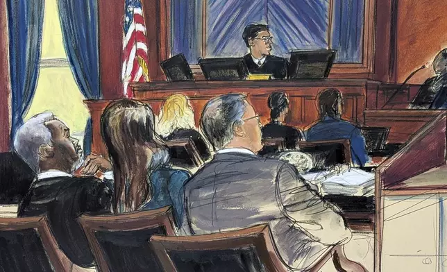Sean 'Diddy' Combs, far left, looks on from the defense table with his attorneys, as a prospective juror, far right, answers questions posed by Judge Arun Subramanian, center, at Manhattan federal court, Monday, May 5, 2025, in New York. (Elizabeth Williams via AP)