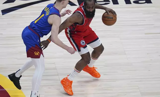 Los Angeles Clippers guard James Harden, right, looks to drive past Denver Nuggets guard Christian Braun, left, in the first half of Game 7 of an NBA basketball first-round playoff series Saturday, May 3, 2025, in Denver. (AP Photo/David Zalubowski)
