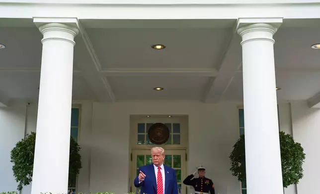 President Donald Trump speaks to reporters outside the West Wing of the White House, Thursday, May 8, 2025, in Washington. (AP Photo/Evan Vucci)