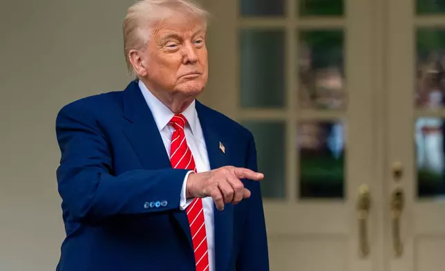 President Donald Trump speaks with reporters in front of the West Wing of the White House, Thursday, May 8, 2025, in Washington. (AP Photo/Alex Brandon)