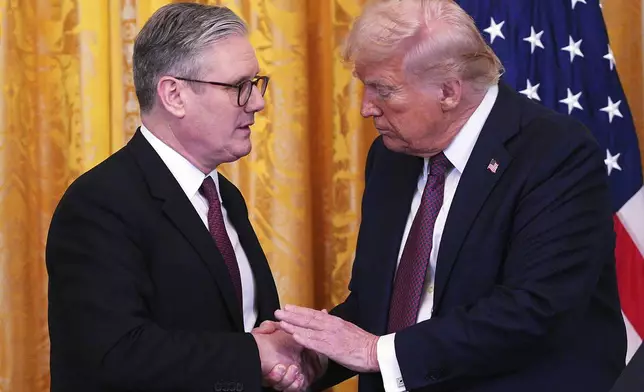 FILE - Britain's Prime Minister Keir Starmer, left, and U.S. President Donald Trump shake hands at a joint press conference in the East Room at the White House Thursday, Feb. 27, 2025, in Washington. (Carl Court/Pool Photo via AP, File)