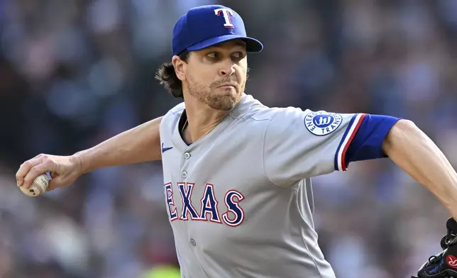 Texas Rangers starting pitcher Jacob deGrom throws against the Detroit Tigers during the first inning of a baseball game Saturday, May 10, 2025, in Detroit. (AP Photo/Lon Horwedel)