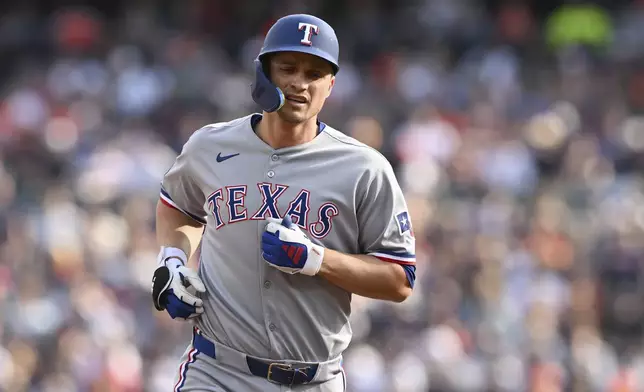 Texas Rangers' Corey Seager rounds the bases after hitting a solo home run against the Detroit Tigers during the first inning of a baseball game Saturday, May 10, 2025, in Detroit. (AP Photo/Lon Horwedel)