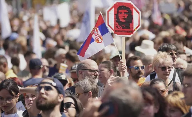 University students and people protest in front of the government building, six months after the deadly train station tragedy that sparked mass demonstrations against corruption, in Belgrade, Serbia, Thursday, May 1, 2025. (AP Photo/Darko Vojinovic)