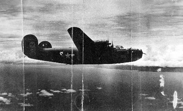 This undated photo shows the World War II B-24 bomber, Heaven Can Wait, that went down in the waters of Hansa Bay, Papua New Guinea in 1944. (Defense POW/MIA Accounting Agency via AP)