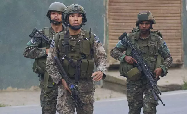 Indian Air Force soldiers arrive at Pampore in Pulwama district of Indian controlled Kashmir, Wednesday, May 7, 2025. (AP Photo/Dar Yasin)