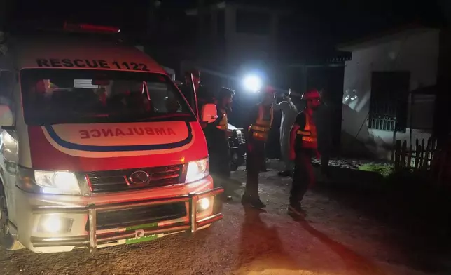 Rescue workers and an ambulance arrive at the site of a suspected Indian missile attack, in Muridke, a town in Pakistan's Punjab province, Wednesday, May 7, 2025. (AP Photo/K.M. Chaudary)