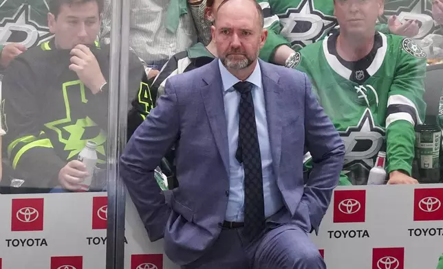 Dallas Stars head coach Peter DeBoer looks on during the third period in Game 2 of the Western Conference finals in the NHL hockey Stanley Cup playoffs, Friday, May 23, 2025, in Dallas. (AP Photo/LM Otero)