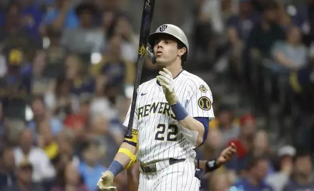 Milwaukee Brewers Christian Yelich reacts after striking out against the Minnesota Twins during the eighth inning of a baseball game, Friday, May 16, 2025, in Milwaukee. (AP Photo/Jeffrey Phelps)