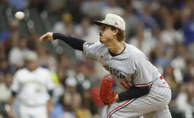 Minnesota Twins starting pitcher Joe Ryan throws against the Milwaukee Brewers during the first inning of a baseball game, Friday, May 16, 2025, in Milwaukee. (AP Photo/Jeffrey Phelps)