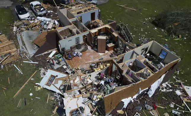 A home is destroyed after a severe storm passed the area on Saturday, May 17, 2025 in London, Ky. (AP Photo/Carolyn Kaster)