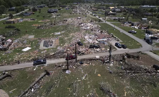 A home is destroyed after a severe storm passed through the area Saturday, May 17, 2025, in London, Ky (AP Photo/Carolyn Kaster)