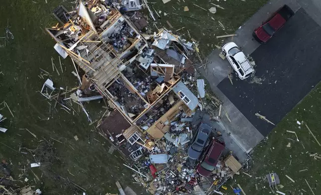 A home is destroyed after a severe storm passed through the area, Saturday, May 17, 2025, in London, Ky. (AP Photo/Carolyn Kaster)