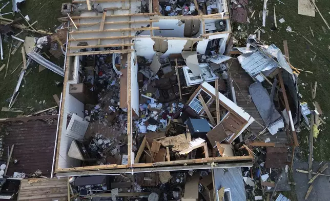 A destoryed home is seen from above after a severe storm passed through the area, Saturday, May 17, 2025, in London, Ky. (AP Photo/Carolyn Kaster)