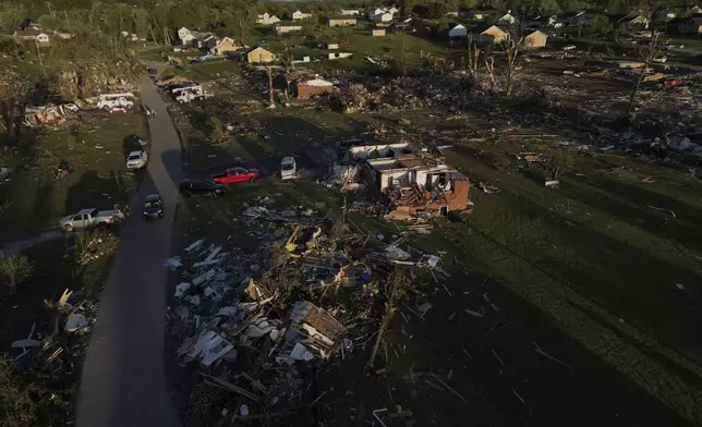 Homes are destroyed after a severe storm passed through the area, Saturday, May 17, 2025, in London, Ky. (AP Photo/Carolyn Kaster)