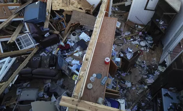 A destoryed home is seen from above after a severe storm passed through the area, Saturday, May 17, 2025, in London, Ky. (AP Photo/Carolyn Kaster)