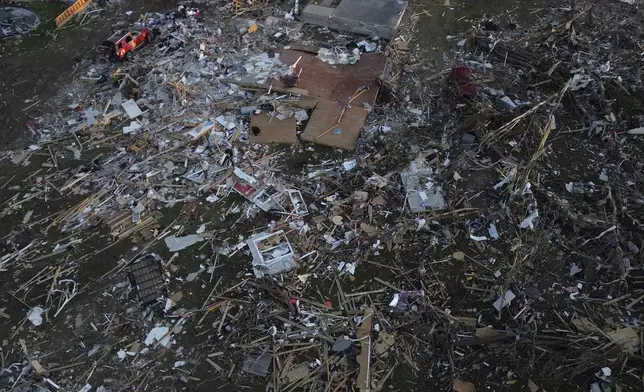 A home is destroyed after a severe storm passed through the area, Saturday, May 17, 2025, in London, Ky. (AP Photo/Carolyn Kaster)