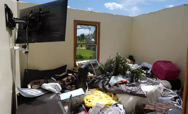 A home is destroyed after a severe storm passed the area on Saturday, May 17, 2025 in London, Ky. (AP Photo/Carolyn Kaster)