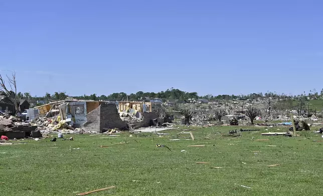 Houses lay destroyed following severe weather in London, Ky., Saturday, May 17, 2025. (AP Photo/Timothy D. Easley)