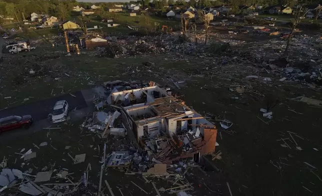 Destroyed homes are seen after a severe storm passed through the area, Saturday, May 17, 2025, in London, Ky. (AP Photo/Carolyn Kaster)