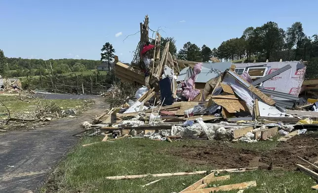 A destroyed home lays in a pile following severe weather in London, Kentucky, Saturday, May 17, 2025. (AP Photo/Dylan Lovan)