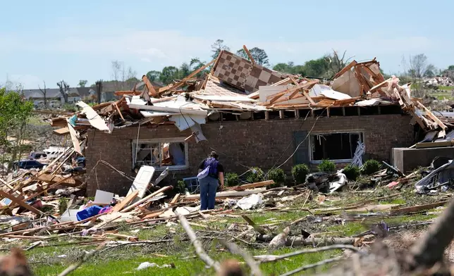 A home is destroyed after a severe storm passed the area on Saturday, May 17, 2025, in London, Ky. (AP Photo/Carolyn Kaster)