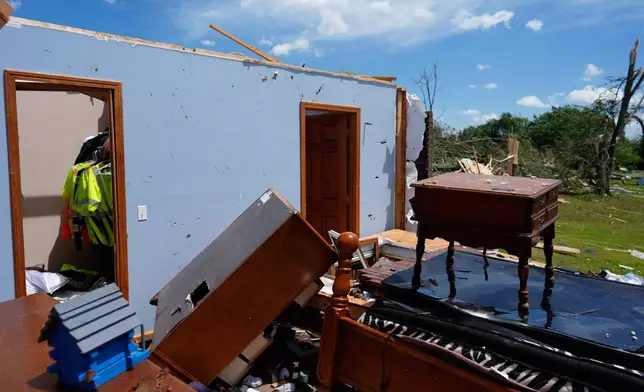 A home is destroyed after a severe storm passed the area on Saturday, May 17, 2025, in London, Ky. (AP Photo/Carolyn Kaster)