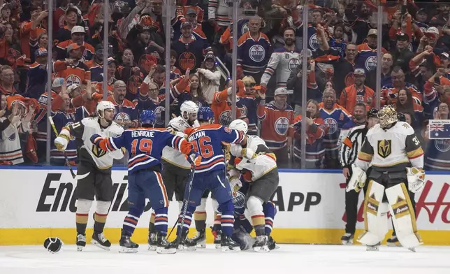 Vegas Golden Knights and Edmonton Oilers rough it up during the first period of Game 4 of a second-round NHL hockey playoff series in Edmonton, Alberta, Monday, May 12, 2025. (Jason Franson/The Canadian Press via AP)