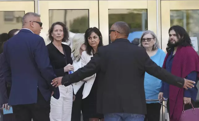Family and supporters of Erik and Lyle Menendez leave court for a lunch break during a hearing in the brothers' case Tuesday, May 13, 2025, in Los Angeles. (AP Photo/Damian Dovarganes)