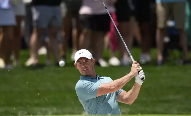Rory McIlroy, of Northern Ireland, hits from the bunker on the 10th hole during a practice round for the PGA Championship golf tournament at the Quail Hollow Club, Wednesday, May 14, 2025, in Charlotte, N.C. (AP Photo/David J. Phillip)