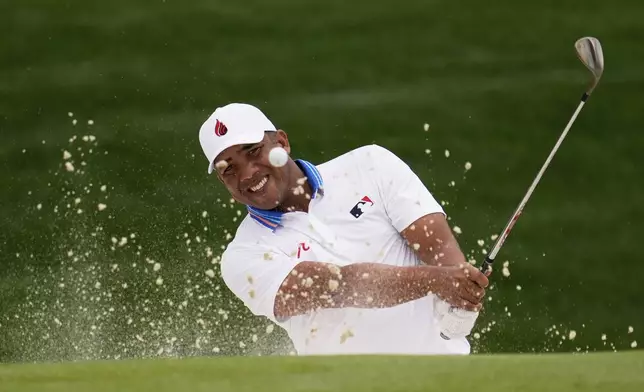 Jhonattan Vegas, of Venezuela, hits from the bunker on the 18th hole during the second round of the PGA Championship golf tournament at the Quail Hollow Club, Friday, May 16, 2025, in Charlotte, N.C. (AP Photo/George Walker IV)