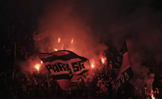 PSG fans cheer their team during the Champions League semifinal, second leg soccer match between Paris Saint-Germain and Arsenal at the Parc des Princes in Paris, Wednesday, May 7, 2025. (AP Photo/Aurelien Morissard)