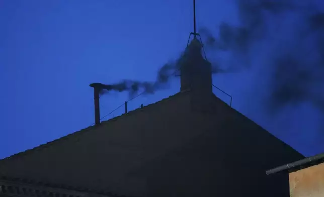 Black smoke billows from the chimney of the Sistine Chapel, where 133 cardinals are gathering on the first day of the conclave, indicating that a successor of late Pope Francis was not elected, Wednesday, May 7, 2025. (AP Photo/Gregorio Borgia)