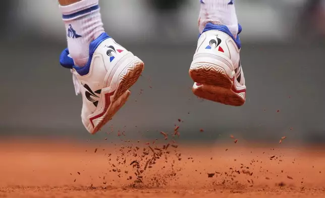 France's Richard Gasquet kicks the clay as he jumps to serve against France's Terence Atmane, during their first round match of the French Tennis Open, at the Roland-Garros stadium, in Paris, Monday, May 26, 2025. (AP Photo/Lindsey Wasson)