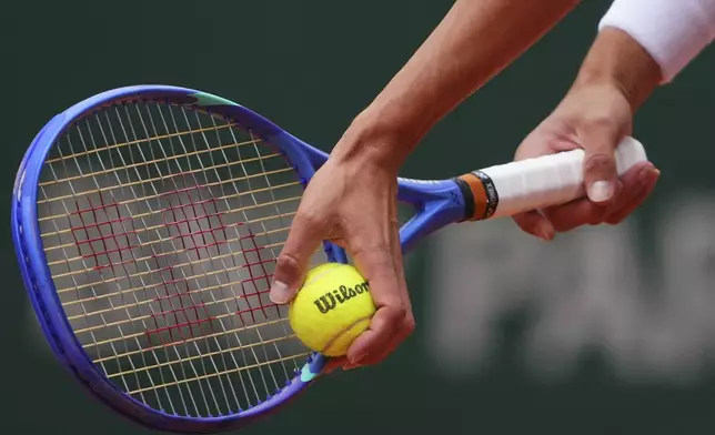 Germany's Daniel Altmaier prepares to serve against Taylor Fritz of the U.S. during their first round match of the French Tennis Open, at the Roland-Garros stadium, in Paris, Monday, May 26, 2025. (AP Photo/Lindsey Wasson)
