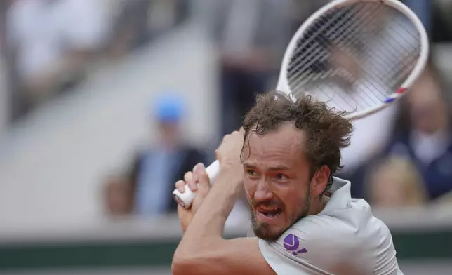 Russia's Daniil Medvedev returns the ball to Britain's Cameron Norrie during their first round match of the French Tennis Open, at the Roland-Garros stadium, in Paris, Tuesday, May 27, 2025. (AP Photo/Thibault Camus)