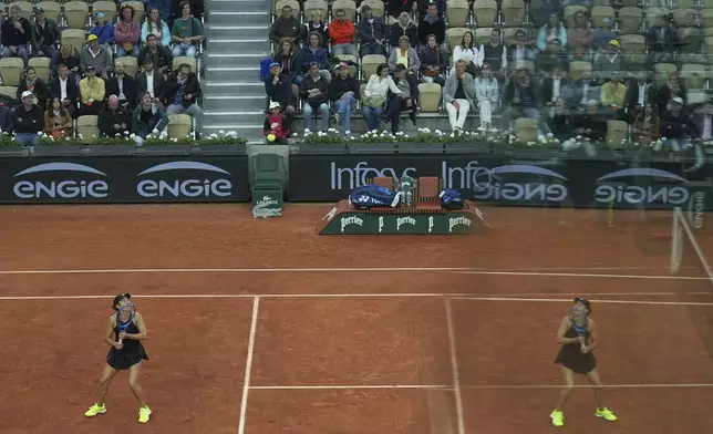 Jessica Pegula of the U.S. is reflected in a glass as she plays Romania's Anca Todoni during their first round match of the French Tennis Open, at the Roland-Garros stadium, in Paris, Tuesday, May 27, 2025. (AP Photo/Aurelien Morissard)