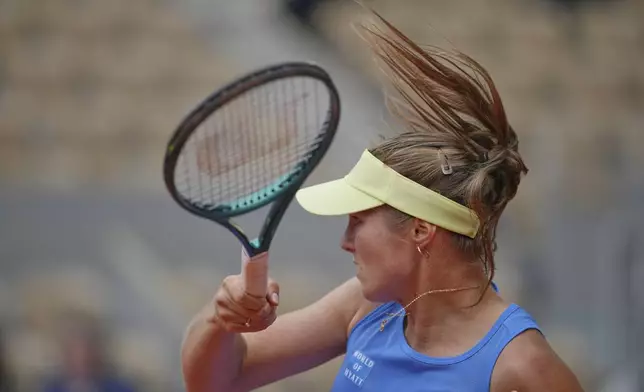 Australia's Olivia Gadecki returns the ball to Coco Gauff of the U.S. during their first round match of the French Tennis Open, at the Roland-Garros stadium, in Paris, Tuesday, May 27, 2025. (AP Photo/Thibault Camus)