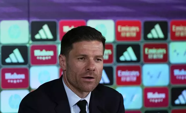 Former footballer Xavi Alonso speaks to reporters during his presentation as Real Madrid's new coach at the Club's headquarters in Madrid on Monday 26 May 2025. (AP Photo/Jose Breton)