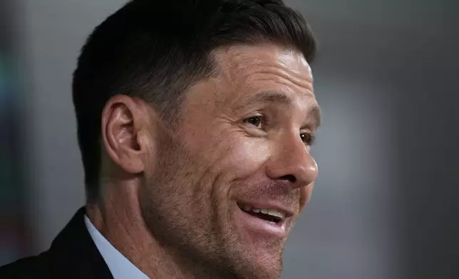Former footballer Xavi Alonso speaks to reporters during his presentation as Real Madrid's new coach at the Club's headquarters in Madrid on Monday 26 May 2025. (AP Photo/Jose Breton)