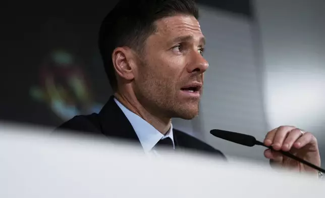 Former footballer Xavi Alonso speaks to reporters during his presentation as Real Madrid's new coach at the Club's headquarters in Madrid on Monday 26 May 2025. (AP Photo/Jose Breton)