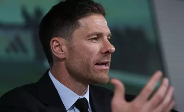 Former footballer Xavi Alonso speaks to reporters during his presentation as Real Madrid's new coach at the Club's headquarters in Madrid on Monday 26 May 2025. (AP Photo/Jose Breton)
