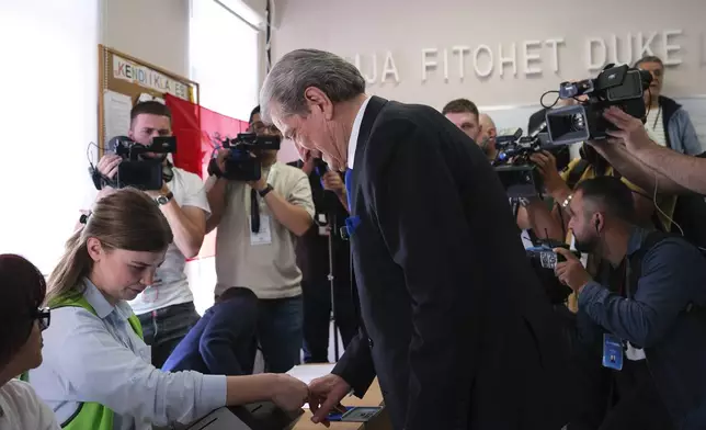 Sali Berisha, leader of Democratic Party of Albania, is seen during a voting procedure at a general election where rival Socialist Edi Rama is seeking a fourth term as Albania's prime minister in Tirana, Albania Sunday, May 11, 2025. (AP Photo)