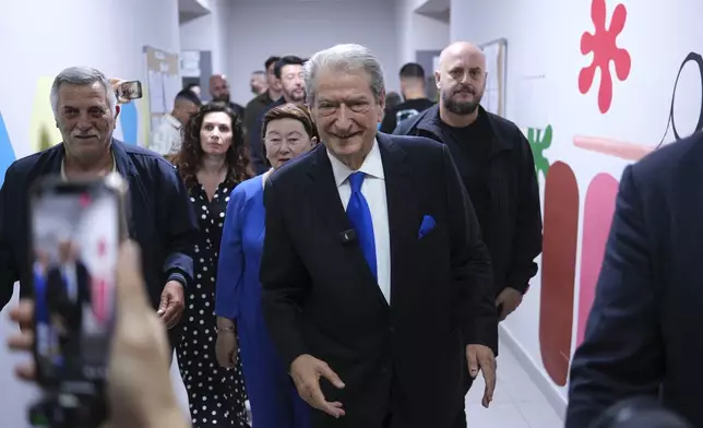 Sali Berisha, leader of Democratic Party of Albania, leaves a voting station during a general election where rival Socialist Edi Rama is seeking a fourth term as Albania's prime minister in Tirana, Albania Sunday, May 11, 2025. (AP Photo)