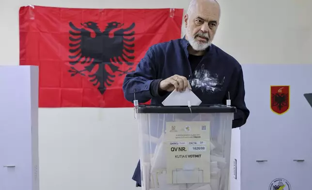 Albania's ruling Socialist party leader Edi Rama casts his ballot during a general election where Rama is seeking a fourth term as Albania's prime minister, in Tirana, Sunday, May 11, 2025. (AP Photo/Vlasov Sulaj)
