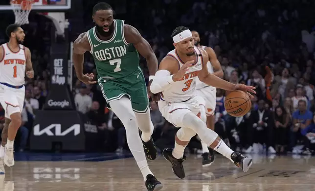 Boston Celtics' Jaylen Brown, left, knocks over New York Knicks' Josh Hart, right, during the first half of Game 3 of an NBA basketball second-round playoff series, Saturday, May 10, 2025, in New York. (AP Photo/Pamela Smith)