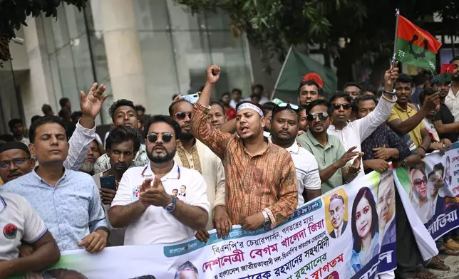 Supporters of Bangladesh's ailing former Prime Minister Khaleda Zia shout slogans as they welcome her arrival from London, in Dhaka, Bangladesh, Tuesday, May 6, 2025. (AP Photo/Mahud Hossain Opu)