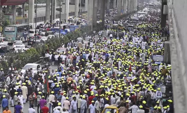 Supporters of Bangladesh's ailing former Prime Minister Khaleda Zia march on a road as they welcome her arrival from London, in Dhaka, Bangladesh, Tuesday, May 6, 2025. (AP Photo/Mahud Hossain Opu)