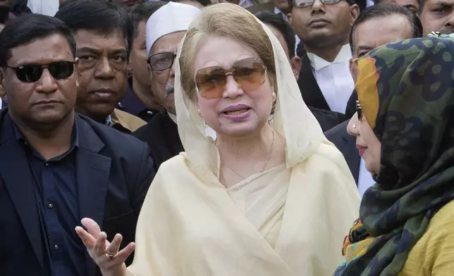 FILE- Bangladesh's former prime minister and Bangladesh Nationalist Party (BNP) chairperson Khaleda Zia, center, leaves after a court appearance in Dhaka, Bangladesh, Dec. 28, 2017. (AP Photo/A.M. Ahad, File)