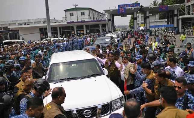 Policemen escort Bangladesh's ailing former Prime Minister Khaleda Zia's motorcade as she leaves from airport after her arrival from London, in Dhaka, Bangladesh, Tuesday, May 6, 2025. (AP Photo/Mahud Hossain Opu)